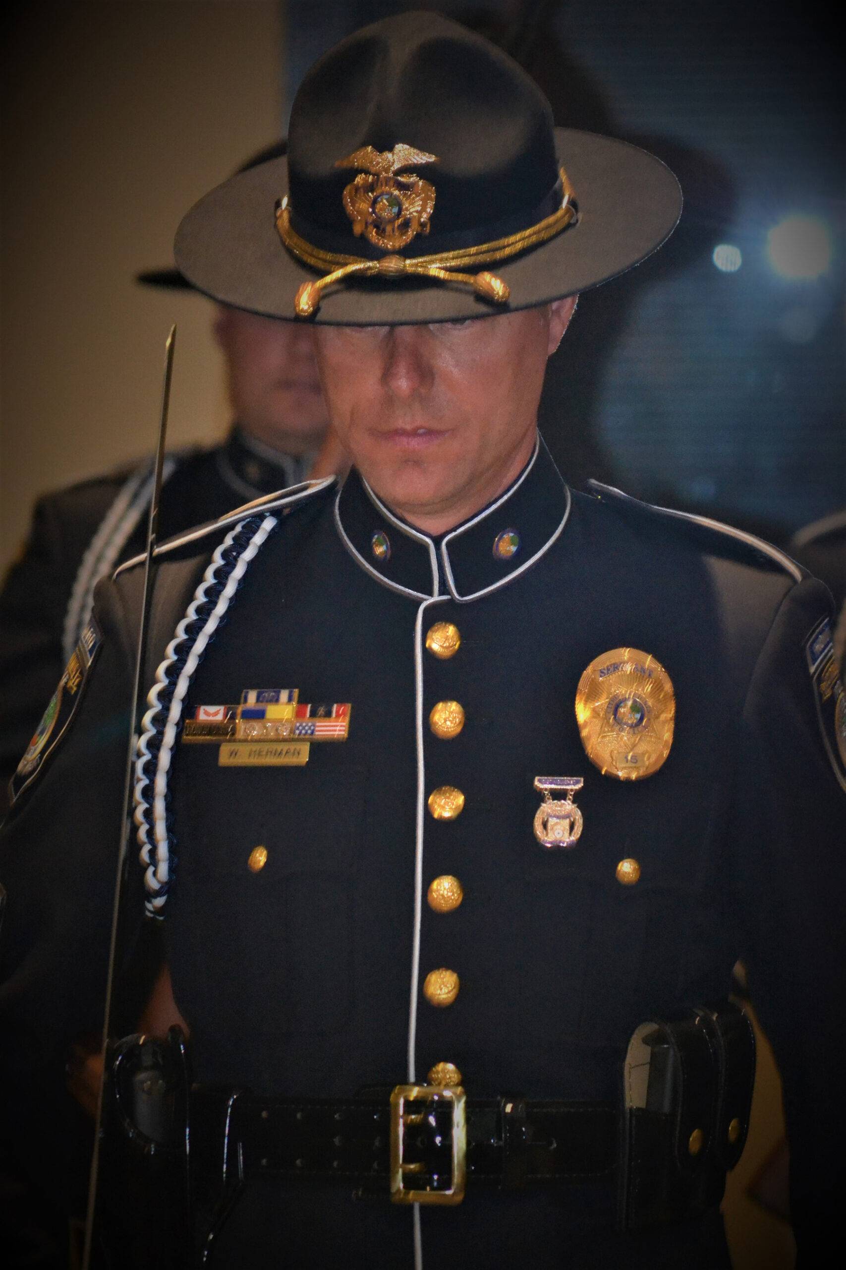 An officer in honor guard, including hat and sword